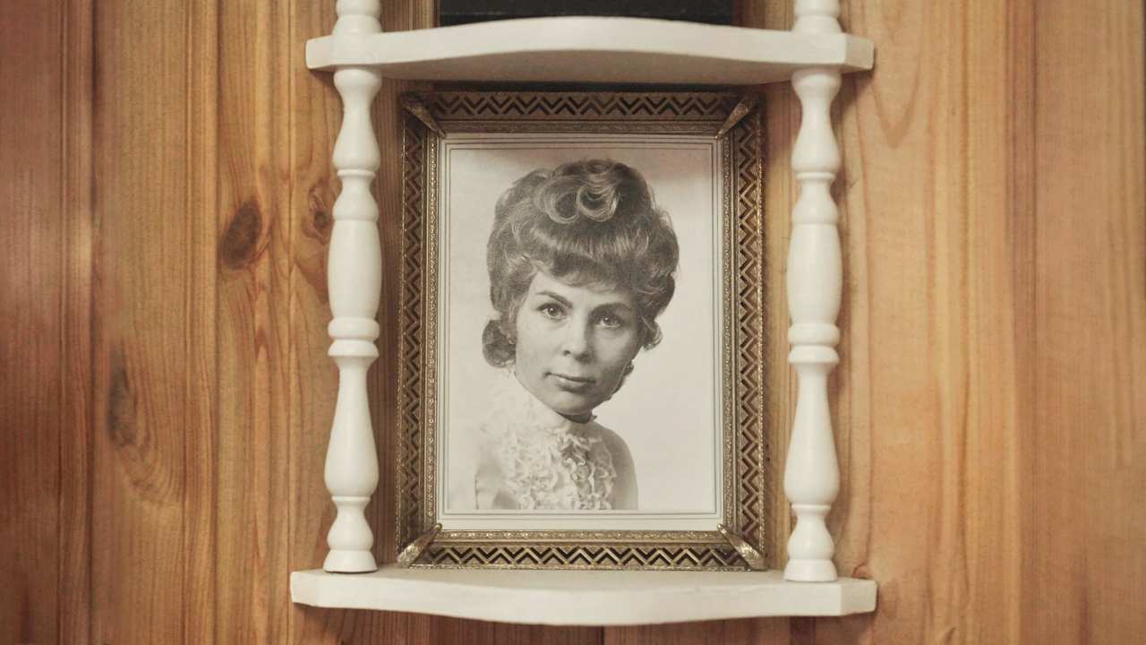 framed vintage photo of a woman with curly hair